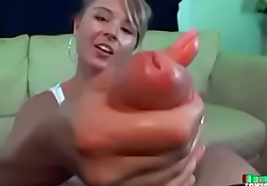 Cute teen Lindsey Manning gets wet jerking a big cock in this best CFNM handjob video