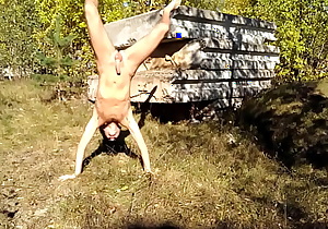 Nudist somersaults in nature
