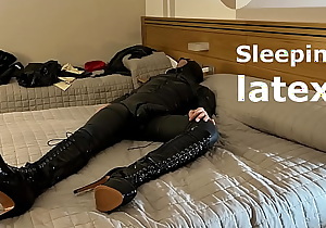 Sleeping wearing latex and high boots