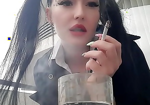 Smoking fetish. Dominatrix Nika smokes sexy and spits into a glass. Imagine that this glass is your mouth, and you are just an ashtray for Mistress.