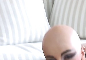 bald head luca bella in a hot latex corset