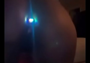 Ebony throwing ass with anal plug in.