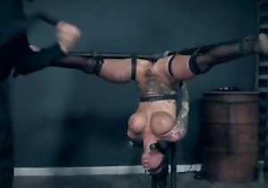 Inked tart with fake tits pleasuring her old hand in BDSM action