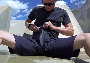 Pissing and cumming inside black shorts in public