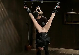 Sub in straitjacket hung for ankles
